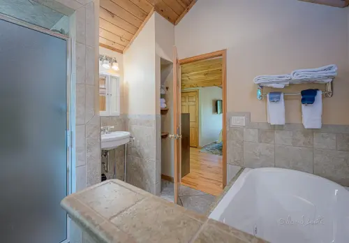 Full Bathroom #5: Attached to the Loft Bedroom with jetted tub and a separate sit/ stand shower